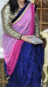 A tie and die Saree in blue an pink colour with golden blouse for elegance look