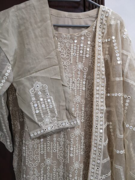 Mirror and embroidery work khaadi net dress.