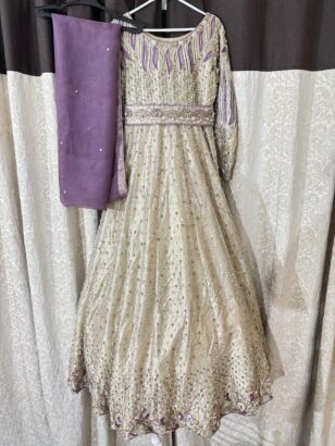 Custom made hardly used golden and purple heavy party dress in an excellent condition